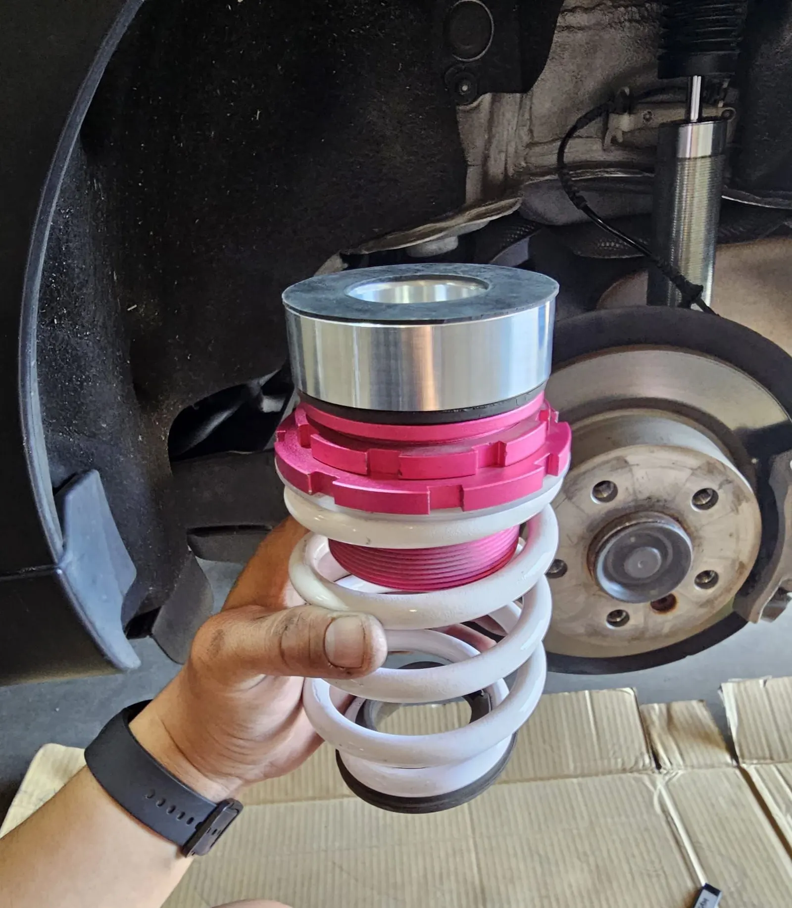 Coilover being installed
